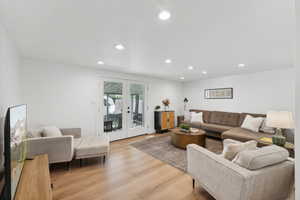 Living room featuring recessed lighting and light wood finished floors