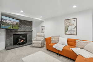 Carpeted living area featuring recessed lighting