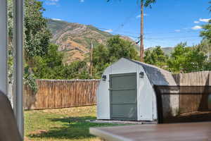 View of shed with a mountain view
