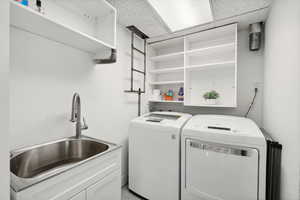 Laundry room featuring washer and clothes dryer