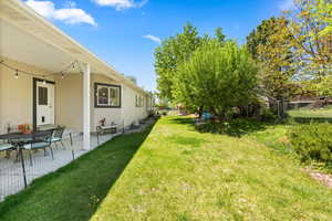 View of yard with a patio area