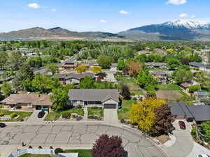 Aerial perspective of suburban area featuring a mountainous background