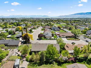 Aerial perspective of suburban area with a mountainous background
