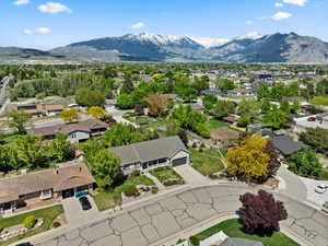 Aerial view of residential area featuring a mountain backdrop