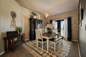 Dining area with carpet flooring and baseboards