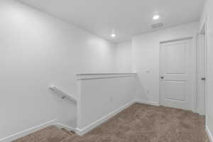 Below grade area featuring carpet flooring, recessed lighting, and baseboards
