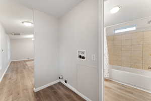 Secondary Bath with vanity, tub/shower combo and laminate flooring
