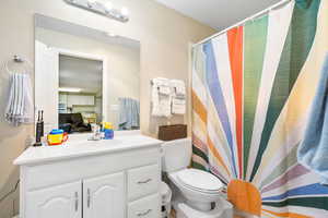 Full bath with vanity and toilet