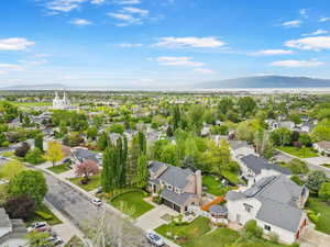 Aerial perspective of suburban area featuring a mountain backdrop