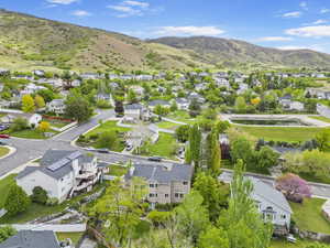 Aerial view of residential area featuring mountains