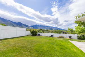 View of yard with a mountain view