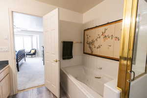 Master Bathroom featuring a tub with jets,