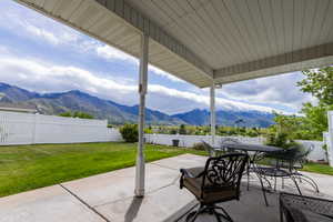 View of patio / terrace featuring a mountain view and outdoor dining space