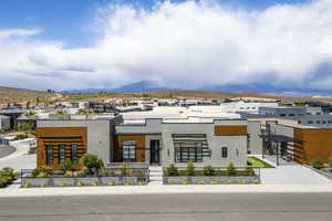 View of property with a mountain view and a residential view