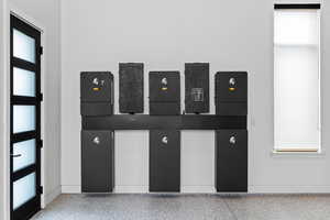 Detailed view of speckle patterned floor and electric panel