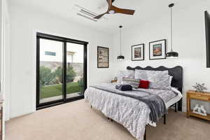 Bedroom with access to outside, light colored carpet, and a ceiling fan