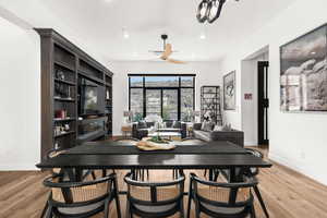 Dining room featuring light wood-style flooring, recessed lighting, and a ceiling fan