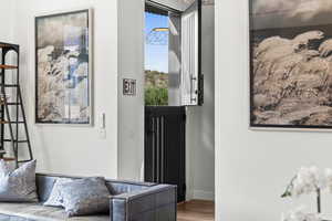 Entryway featuring wood finished floors and baseboards