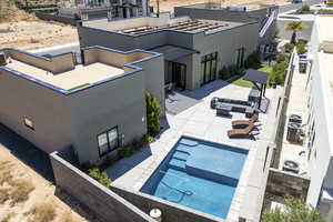 View of swimming pool featuring patio surround and outdoor furniture