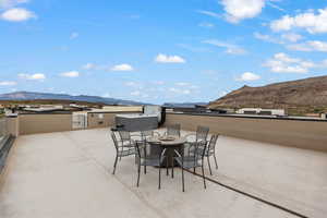 View of patio featuring a mountain view and an outdoor fire pit