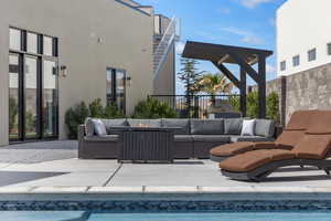 View of pool featuring an outdoor hangout area, a patio, and a swimming pool