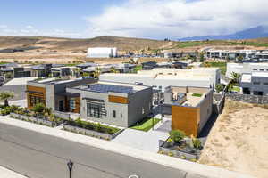Aerial view of residential area featuring a mountainous background
