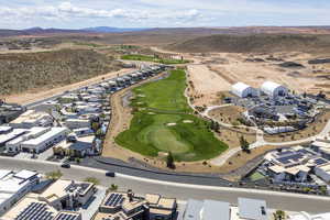 Aerial view of a mountain backdrop and a golf club