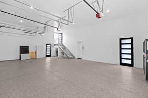 Garage featuring recessed lighting and a garage door opener