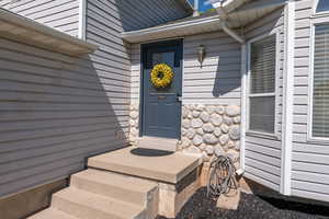 View of front porch and doorway entry to property