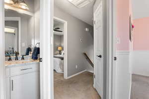 Bathroom featuring vanity and baseboards