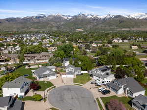 Aerial perspective of suburban area featuring a mountain backdrop