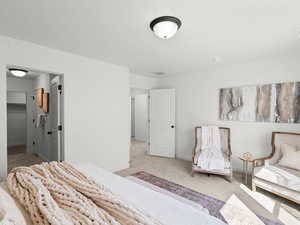 Bedroom featuring baseboards and carpet