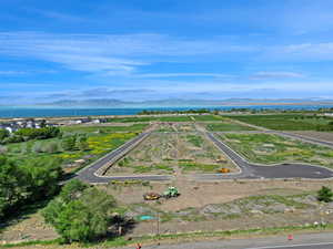 Aerial view of property and surrounding area with a Willard bay  and mountain view