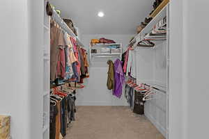 Huge Walk in closet with carpet in Owners suite