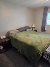 Bedroom featuring a textured ceiling