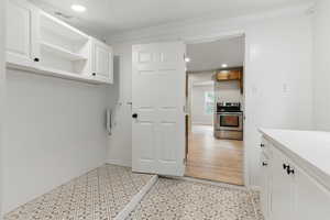 Mudroom featuring recessed lighting and light floors
