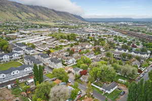 Aerial perspective of suburban area featuring a mountainous background