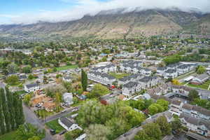 Aerial view of property's location featuring mountains and nearby suburban area