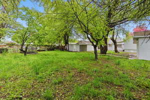 View of yard featuring fence