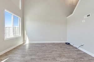 Empty room with wood finished floors and baseboards