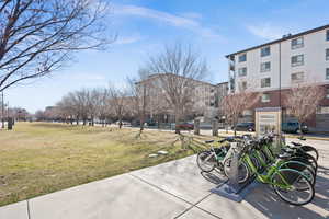 Large lawn space, community bike rental in 500 West median park