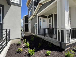 View of side of home with covered porch