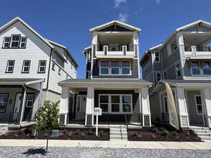 View of front facade featuring a porch and a balcony