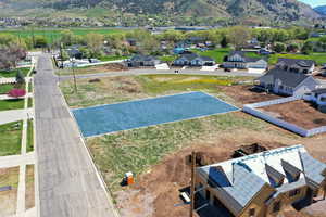 Aerial view of residential area featuring mountains