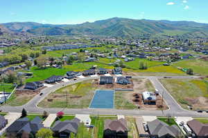 Aerial view of residential area featuring a mountainous background