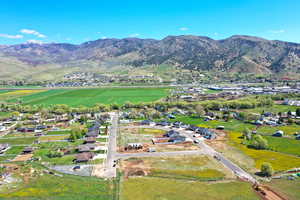 Aerial view of property's location with a mountainous background