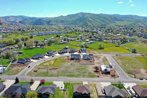 Aerial perspective of suburban area with a mountain backdrop