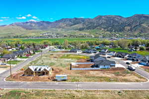 Aerial view of residential area featuring a mountainous background