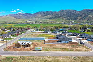 Aerial view of residential area featuring a mountain backdrop