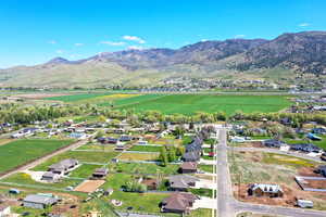 Aerial view of property's location featuring mountains and rural landscape